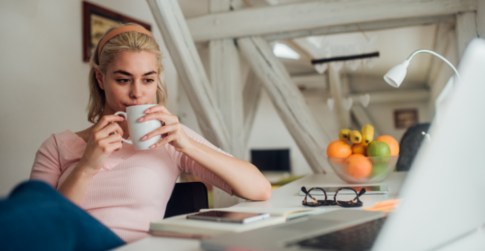 Young woman sipping on a coffee