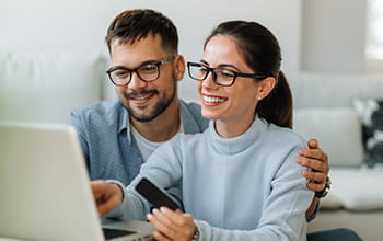 Couple using laptop