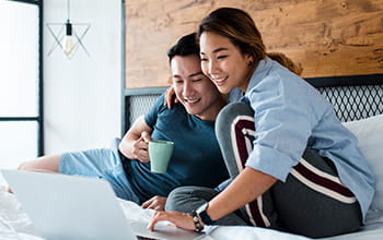 Couple using laptop
                        