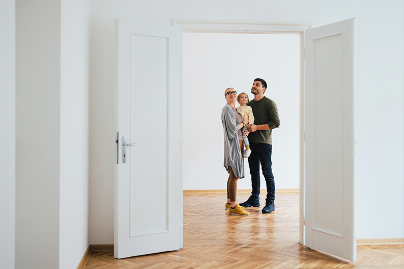 a couple with their daughter and new home