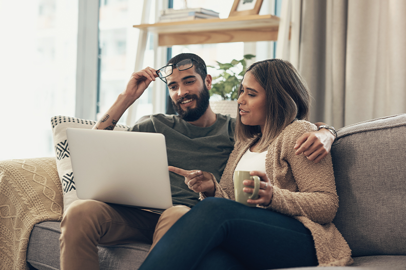 couple checking their laptop